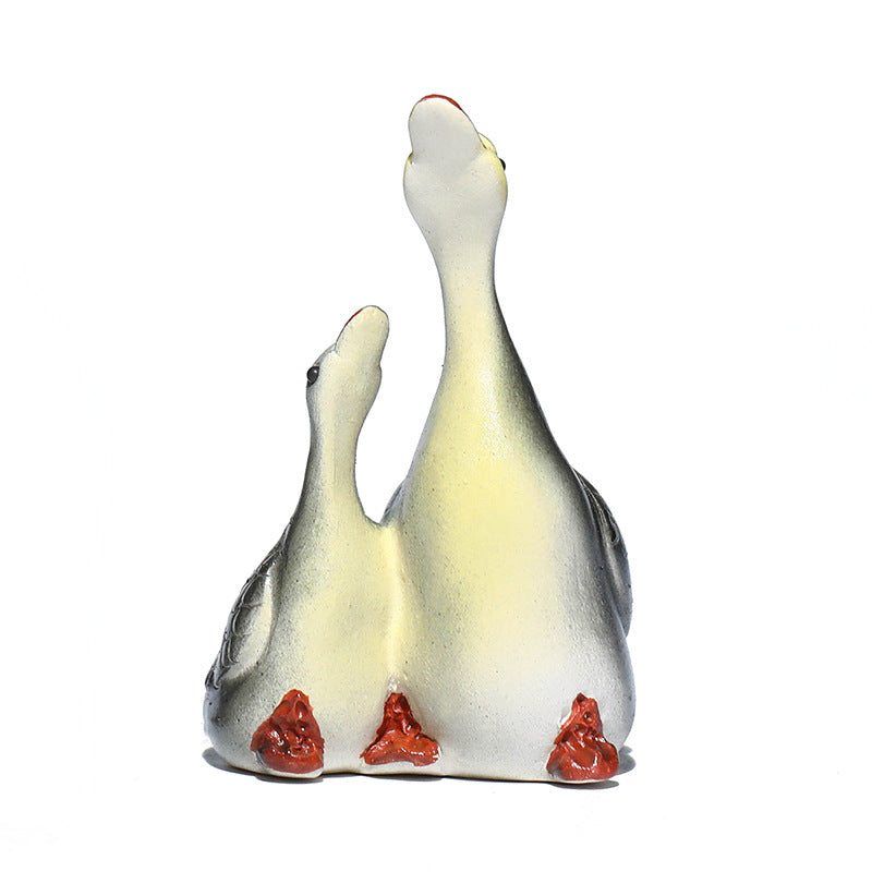 A pair of couple swan ceramic sculpture tea tray ornaments made of Yixing purple clay with color-changing tea pets