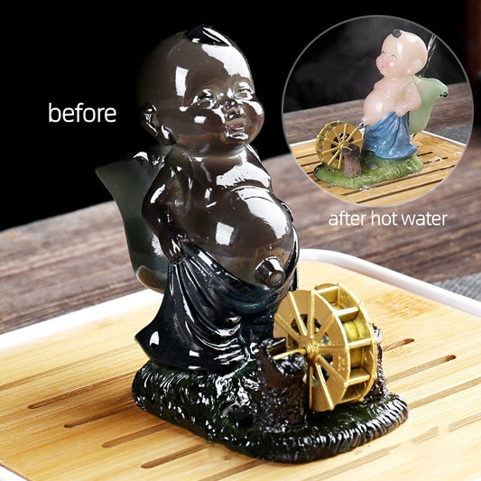 The color-changing tea pet, peeing baby and child, water-spraying tea toy, and the kung Fu tea set symbolize a continuous flow of wealth
